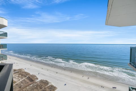 Sit outside and relax on this ocean view balcony and listen to the waves.