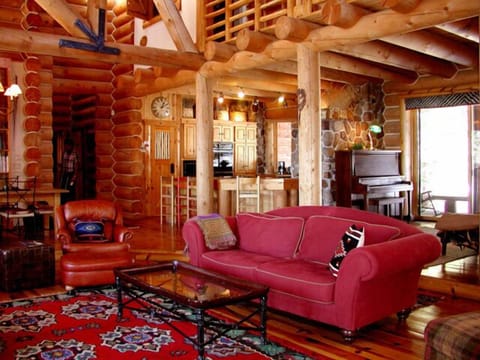 Large open floor plan viewing living room, open den, kitchen and dining area