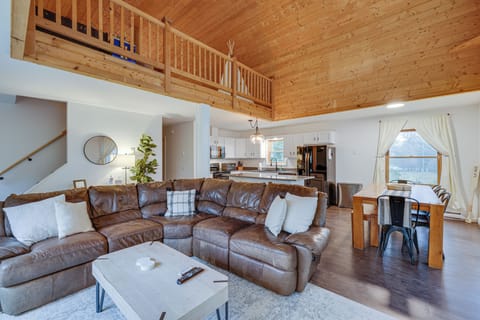 The downstairs opens up to the loft + beautiful pine ceilings.  Bright and open!