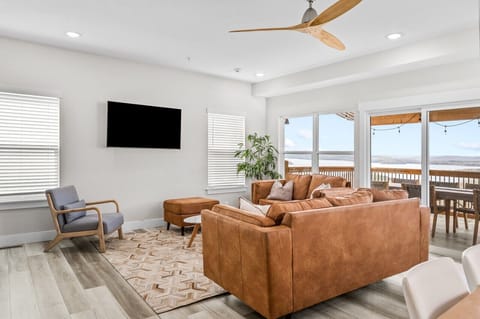 Main level living room with deck access and gorgeous lake view