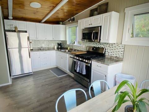 Kitchen has stainless appliances including gas range w/ griddle & dishwasher 