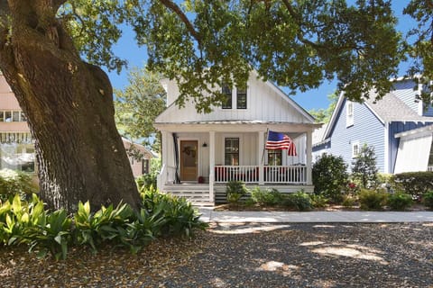 Front of house under the shade of a stately large Live Oak tree