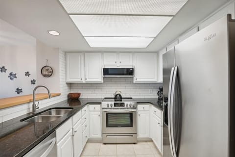 Kitchen with Stainless Steel Appliances at 1830 Beachside Tennis