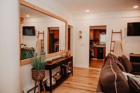 This cozy living space flows right off the kitchen— and the views? You’ll catch them no matter where you sit.