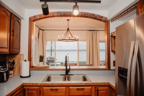 A well-stocked kitchen with everything you need— and a view of the lake while you cook.