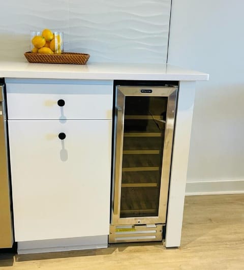 Full kitchen with wine-cooler and coffee machine