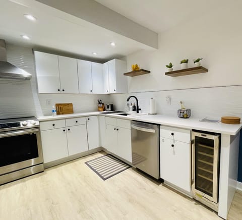 Full kitchen with wine-cooler and coffee machine