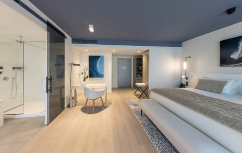 Suite, 1 King Bed, Pool Access | Minibar, in-room safe, laptop workspace, soundproofing