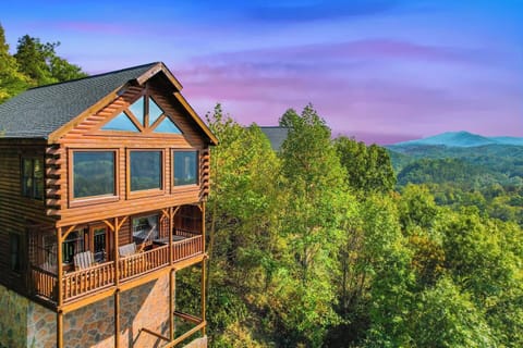 Relax on the porch overlooking a valley and mountain tops