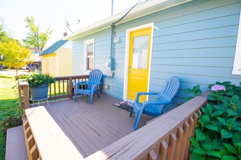 People watch on front porch at Printers Lane