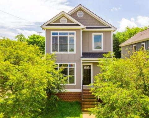 The home sits grandly on the side of a public park