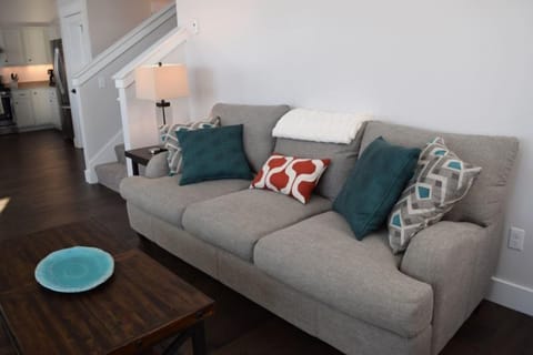 The living room is well- appointed with plush seating.