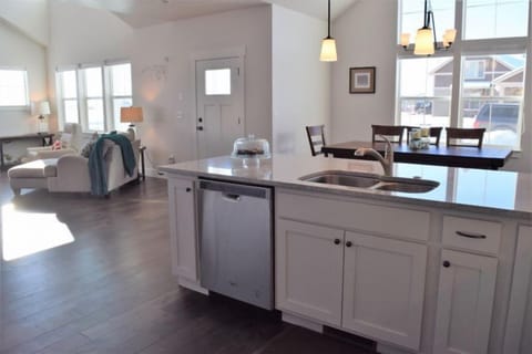 The home offers an open- concept layout in the main living space.