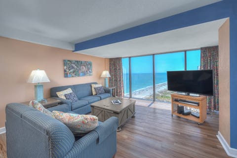 Let in the sun rays as you relax in the comfort of this living room with a view.