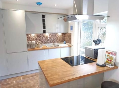 Open plan kitchen with breakfast bar.