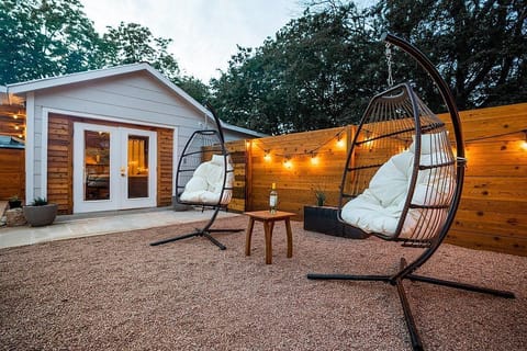 The entire backyard is circled by string lights which make it a magical setting.