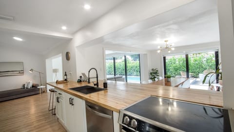 Beautiful butcher block counter for extra sitting and cooking