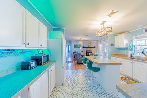 Light and bright kitchen with tons of cabinets and lots of amenities.