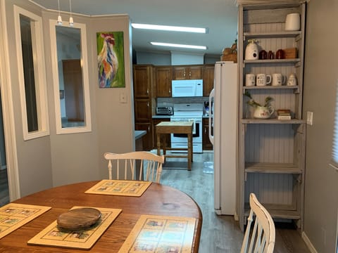 Looking from breakfast room into kitchen area .