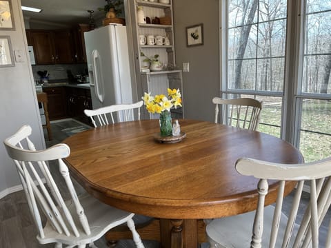 Breakfast room surrounded by windows.  Bringing nature right up close.
