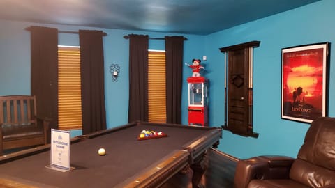 Entertainment & fun in this game room complete w/ popcorn machine for movie nite