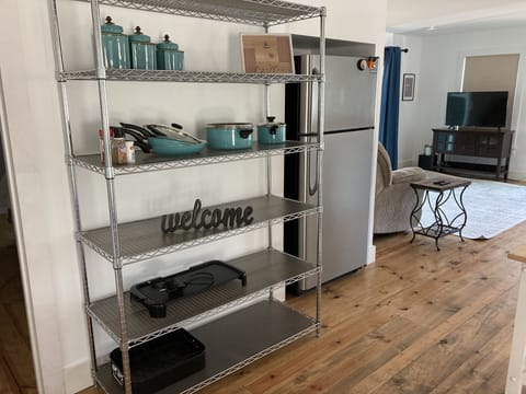 Fully stocked kitchen-coffee pot, pots/pans, cookie sheets, cake pans, crockpot.