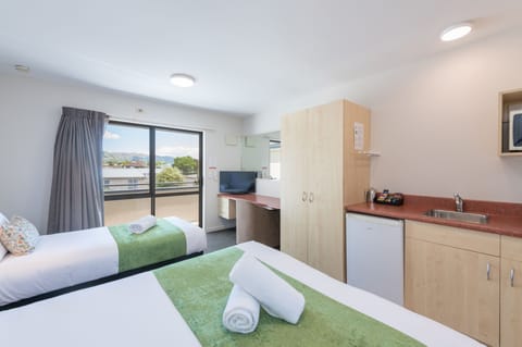 Twin/Triple Studio | Premium bedding, desk, laptop workspace, blackout drapes
