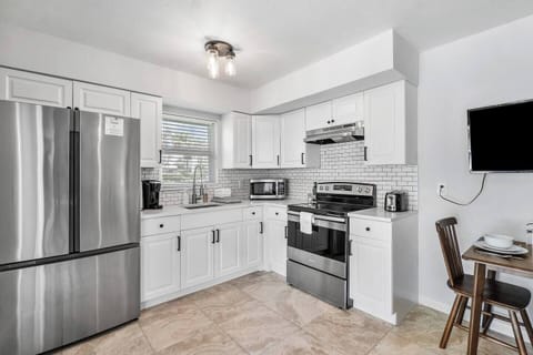 The cozy eat in kitchen is the perfect spot for enjoying a quiet meal or a quick cup of coffee. 