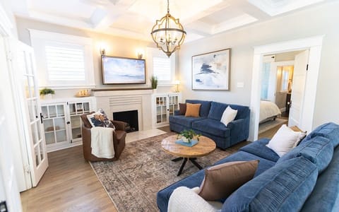 Enjoy an elegantly styled living room featuring velvet sofas.