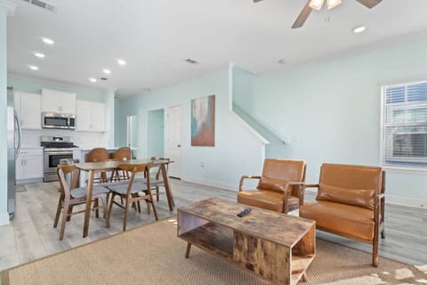 Open concept living area with 70 inch smart TV ready for all streaming stations (with your own login) such as Netflix, Disney+, Amazon Prime, etc. High speed internet.Real plants add a beachy feel.