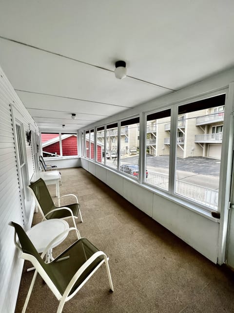 Perched just above the front patio in the screened porch; more people watching!