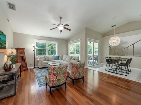 Main living area has hardwood floors and tile. Sliding doors to the patio.