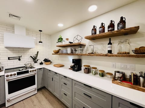Kitchen with coffee maker, complimentary coffee and tea