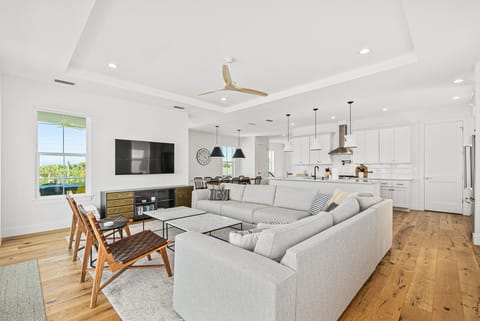 Relax on the plush sofa in the spacious living area surrounding the Smart TV