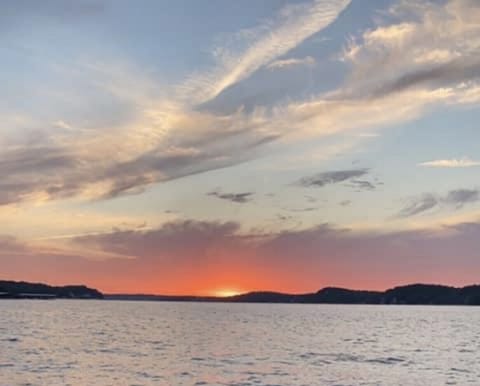 Sunset view picture taken from my boat in the front of the condo’s cove