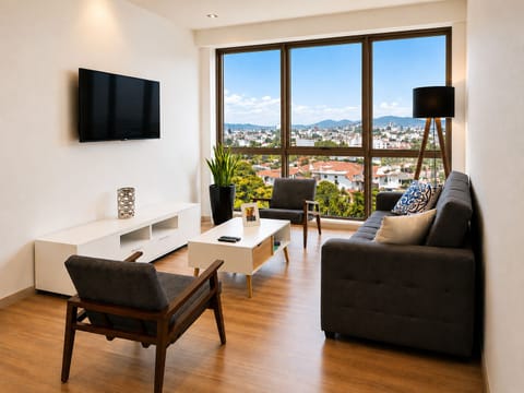 Living room with a 55" UHD Smart TV and Full Sofabed