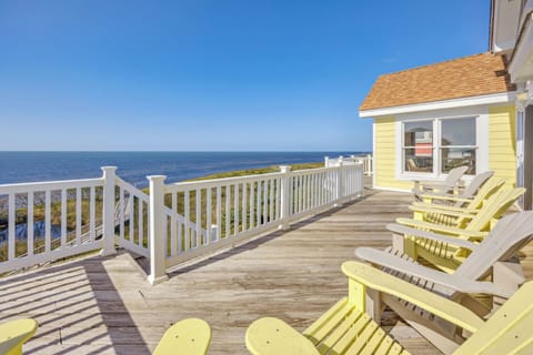 A spacious deck with multiple seating options, offering stunning water views for ultimate relaxation.