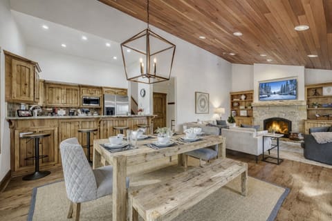 You'll love gathering around this rustic dining table while the fireplace crackles nearby, creating perfect moments in your mountain getaway.