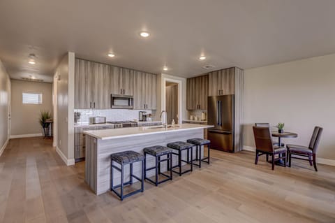 Open and modern kitchen and dining area.