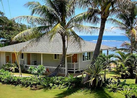 Hawaiian style beach house with vaulted ceilings and a huge Lanai on the beach!