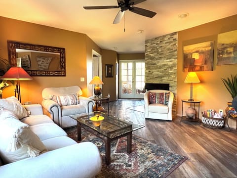 Double doors through the living area open to the expansive screened balcony