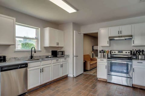 This modern kitchen is fully equipped, providing everything you need to prepare meals with ease and style during your stay.