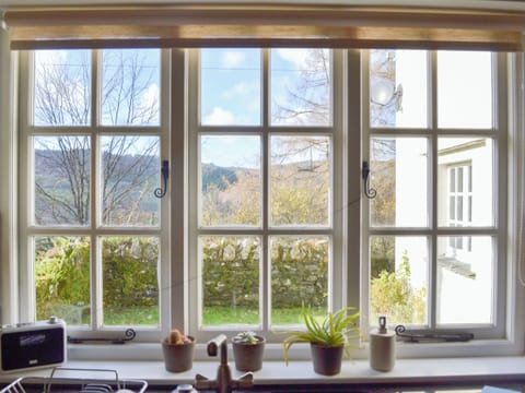Gorgeous views of the surrounding fells from the kitchen | Breasty Haw, Satterthwaite