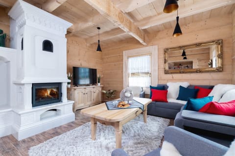 Living room with a comfortable sofa and TV. 