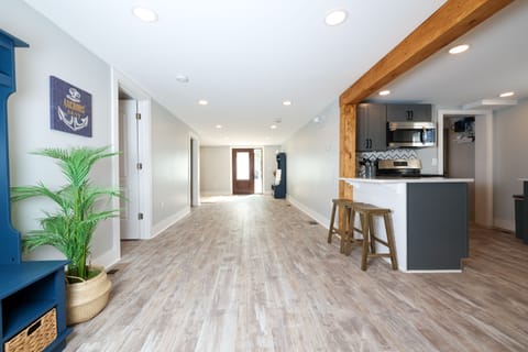 Open and flowing floor plan leads to Indian Lake.