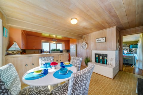 Dining nook next to the kitchen with candle-filled fireplace