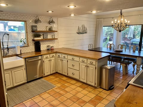 Large bar area with seating to enjoy company while in the kitchen.