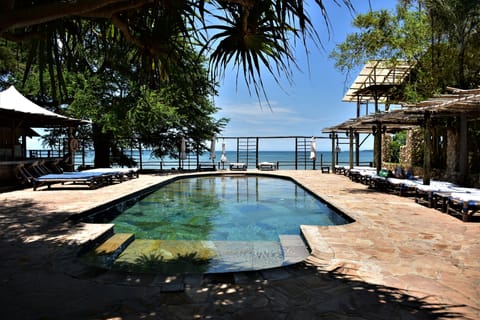 Outdoor pool, free cabanas, pool umbrellas
