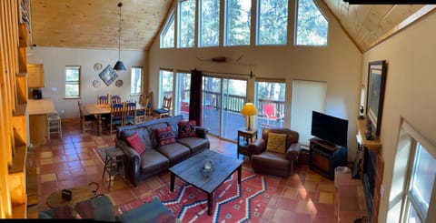 Living area on main floor with dining room in the background.