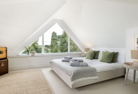 First floor: The stunning master bedroom with feature window (with blinds)